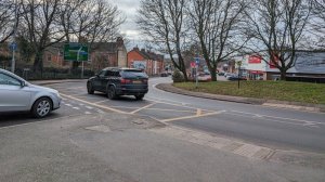 A road junction and two cars